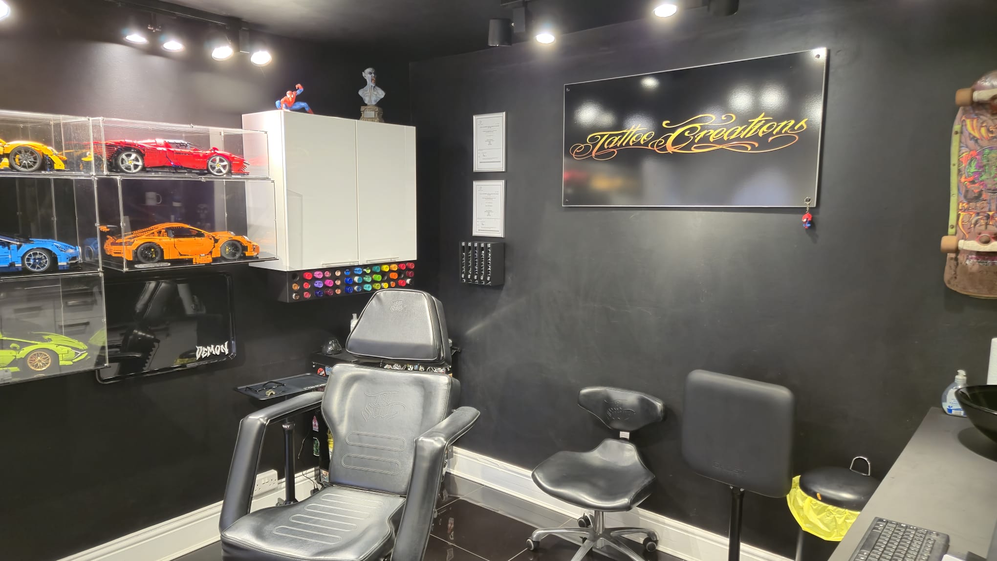 Tattoo artist working on a custom tattoo in Derby
